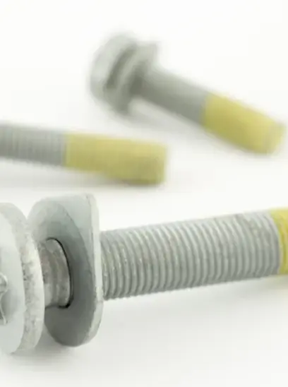 Metal bolts with washers and yellow markings